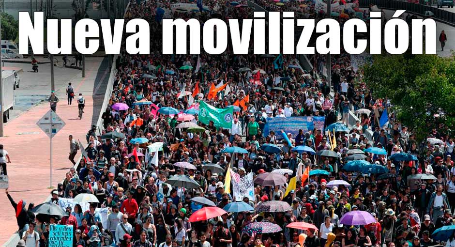 Pese a que avanzan por buen camino las negociaciones Personas en una calle marchando